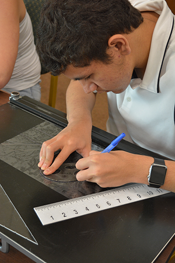 Jordan Main using a raised line drafting board during STEM EQ in Maryland.