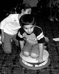 Mohamad Hashash discovers the Dizzy Disk Jr. from Quantum Toys at the 2001 NFB Convention Family Hospitality night