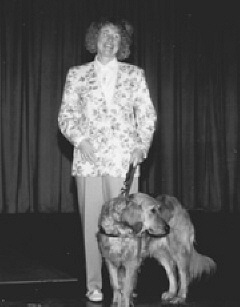 Dana Ard, with the help of her well-behaved guide dog, models and outfit for a ,ocal fashion show in Boise, Idaho.