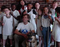 Erik Weihenmayer with his guide dog and blind children from the Maryland KIDS Camp program.