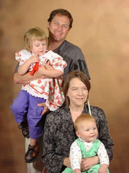 Noel Nightingale and her husband Jim Peterson holding their children Cosmo and Leila