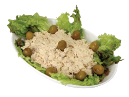 Chicken salad garnished with lettuce and olives.