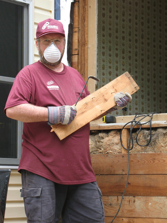 John Cheadle does some carpentry work around the house.