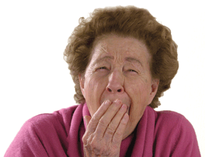 A woman yawning and looking extremely tired.