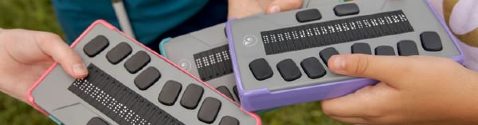 Three Chameleon 20 Braille displays with different bumper colors; photo courtesy of APH.
