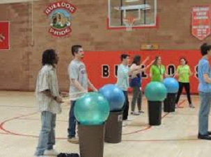 People gather for a cardio drumming class led by Jessica Beecham at the Colorado School for the Deaf and Blind.