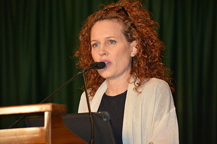 Marilee Talkington, 2020 Dr. Jacob Bolotin award recipient, speaking at a microphone. 