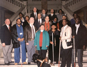 Left to right first row:  Georgia governor Sonny Perdue; Al Tyler; Leo Healey; Diane Healey; Stephanie Scott; Anil Lewis, NFB of Georgia president; Robert Smith; second row: Anne Parker; Cheryl Hodge; Jerry Williams; Lewis Wallach; Louise Pearson; Raj Mehta; Shirley Pittman; third row: Franklin Halsey; Ernie Sledge; Paivy Ballayan; and Wayne High