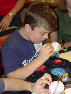Peter Myers of Kentucky working hard on his model of a planet.