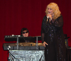 Alice Lockwood accompanies Jeannie Romeo on the piano.