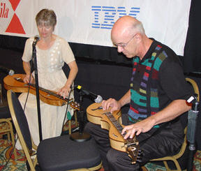 Mountain dulcimer players, Lorrinda Jones and Bruce Adair, play a medley of songs by Stephen Foster during the opening ceremonies of the NFB 2005 convention.