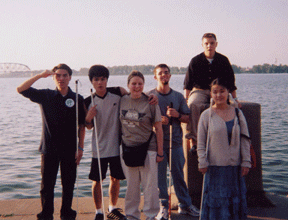 The NFB EXCEL interns stand at the Louisville waterfront. Left to right they are Thien Vu, David Wright, Grace King, Andrew Mayles, Jeremiah Griswold, and Amy Herstein. 