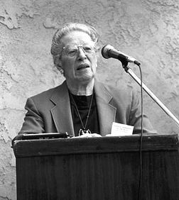 Mrs. tenBroek at microphone. CAPTION: For many years Mrs. tenBroek ran the Federation's Berkeley office, maintained the Monitor mailing list, and did editing and layout work for the magazine.