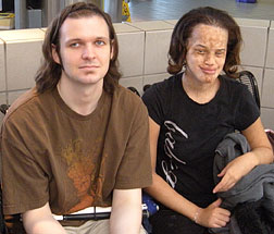Blake Sinnett and Erika Johnson sit waiting.