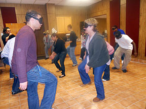 Kathy Michielsen (center) step dances with students in the Youth Leadership Academy.