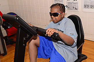 A blind woman enjoys a workout.