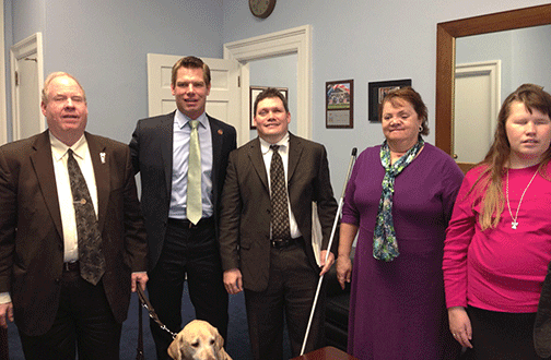Michael Hingson, Congressman Eric Swalwell, Brian Buhrow, Mary Willows, and Jennifer Holloway, a group from the NFB of California, visit about the issues important to the blind and leave their Congressman with our legislative agenda and factsheets.