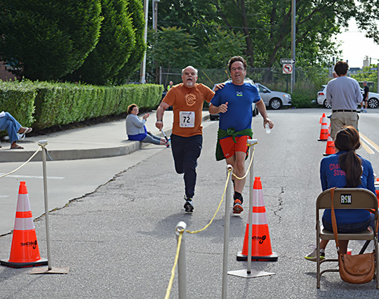 Kevan Worley runs with a sighted guide.