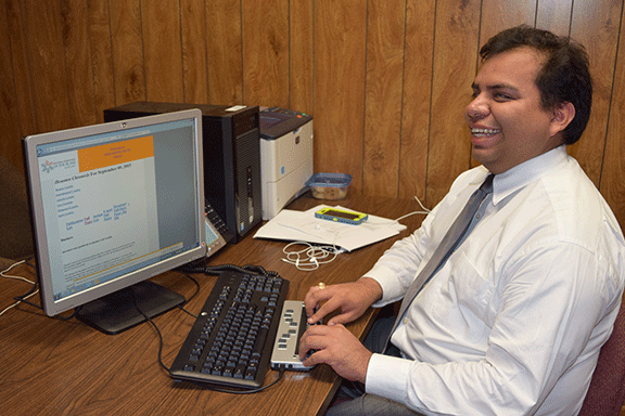 Gabe Cazares uses NFB-NEWSLINE with a Braille display 