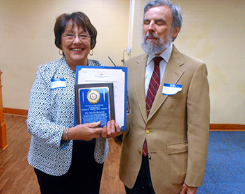 Ed McDonald receives his award.