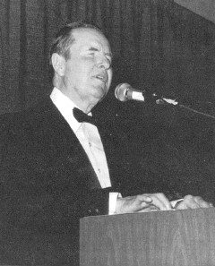 Photo of Dr. Jernigan, dressed in a tuxedo, addressing 
  the National Convention of the Blind. The caption reads: Kenneth Jernigan, November 13, 
  1926, October 12, 1998