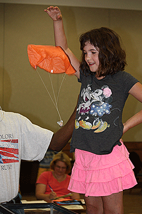 Abby Duffy experiments with a small parachute