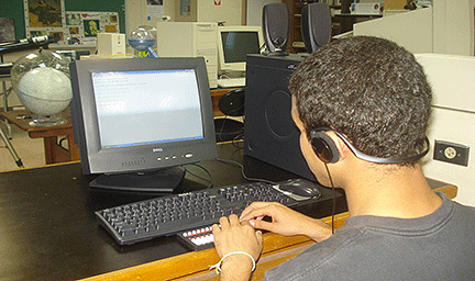 One of Gloria's students using a computer with the JAWS screen reader