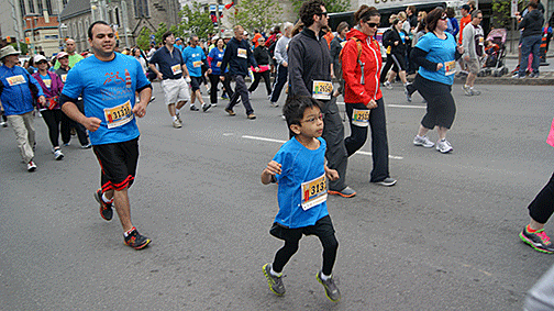 Jayden running among other runners during the Ottawa Race Weekend.