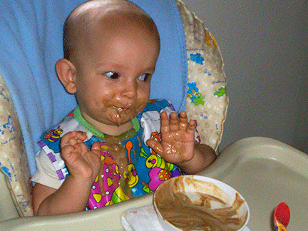 Baby Ivan eats yogurt.