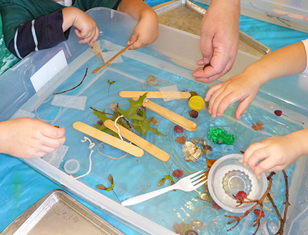 Children&rsquo;s experiment to learn which objects will float in a pan of water.