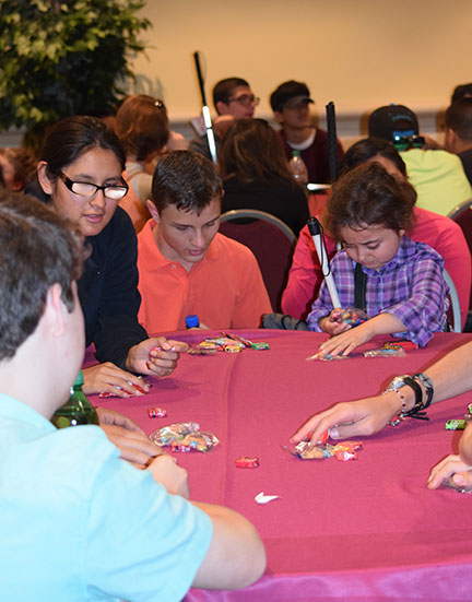 Julia Gebert and her friends play cards.