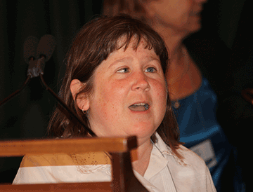 Karen Hedrick of Desire2Learn at the podium accepting the Jacob Bolotin award.