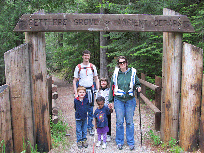 The Jepsen family stands at the entrance to a park called Settlers Grove of Ancient Cedars. See "If I Wrote His IEP"